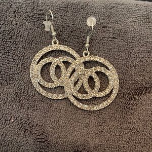 Silver and gold earring set.